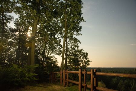 wooden fence at night on the meadowの写真素材