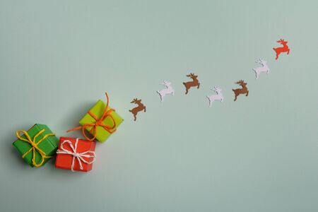 christmas presents nicely decorated with bows and feathers. view from above. Reindeers.の写真素材