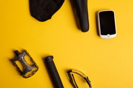 Bicycle, Cycling accessories on the yellow background. view from aboveの写真素材