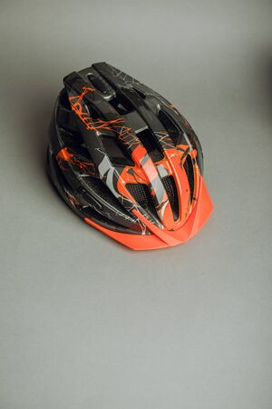 Helmet, gloves, shoes and water bottle - bicycle accessories. Orange colorの写真素材