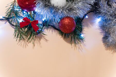 Christmas or New Year background, plain composition made of Xmas decorations and fir branches, flat lay, blank space for a greeting text.の写真素材