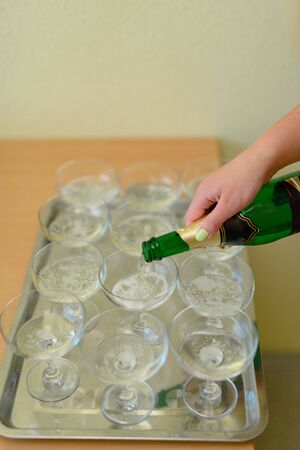 first toast of the bride and groom with a glass of champagneの写真素材