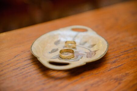 Beautiful two golden wedding rings. Made of highest quality materialの写真素材