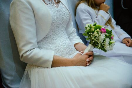 Bride and groom at church wedding during ceremony. Beautiful decorationの写真素材