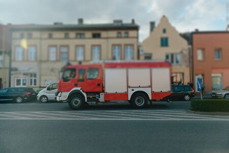 Beautiful wedding couple on outdoor photoshoot with fire truckの写真素材