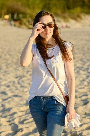 Portrait of smiling young woman enjoying the time.の写真素材