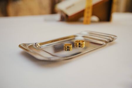 Beautiful two golden wedding rings. Made of highest quality materialの写真素材