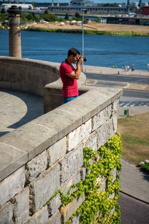 Photographer's boyfriend takes a photo. Summer season. Nature and landscape photographyの写真素材