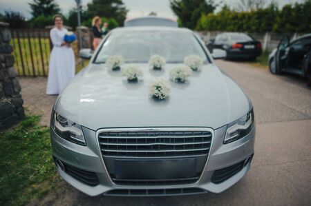 Luxury wedding car decorated with beautiful flowers. Brides and grooms wedding dayの写真素材