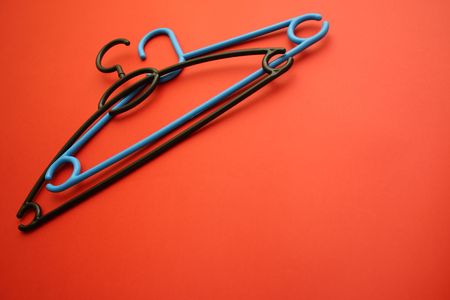 against the backdrop of hangers for clothesの写真素材