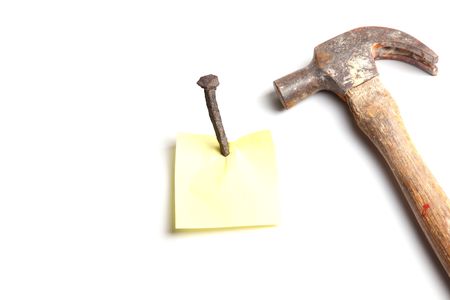 note with nail over white backgroundの写真素材