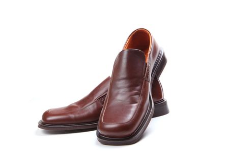 on a white background are brown pair of shoes の写真素材