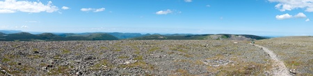 Wide panorama from the top of a tundra covered mountainの写真素材