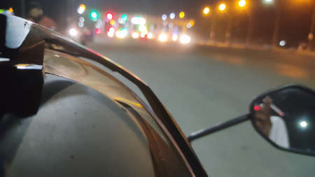 Close up view of the rearview mirror of a car in the night.の写真素材