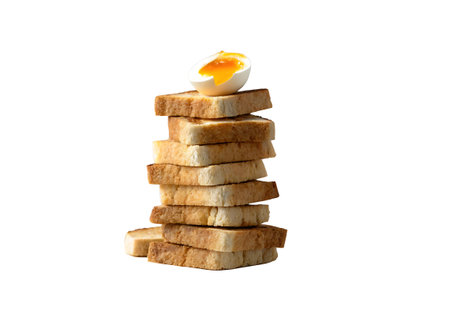 Stack of toasted bread with egg isolated on a white background.の素材