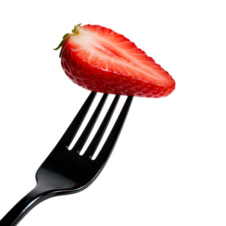 Strawberry on a fork, isolated on white background with clipping pathの素材