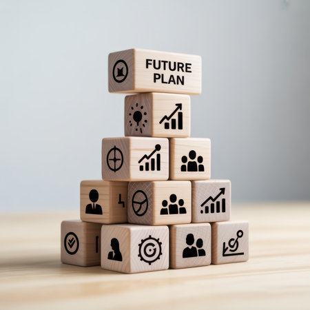 The a pyramid structure made of wooden blocks, each featuring different business-related The block has the text "FUTURE PLAN" and an upward arrow The blocks below display various representing growth, teamwork, strategy, and success. The blocks are arranged in a pyramid shape on a light wooden surface, creating a minimalist and modern visual concept related to business planning and corporate strategy.の素材
