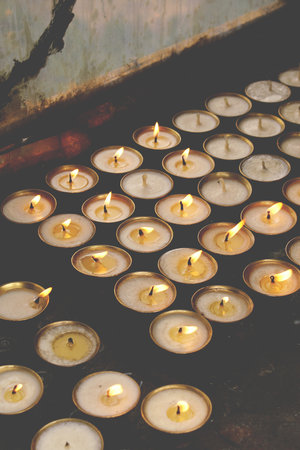 Tea Light Candles in the Templeの写真素材