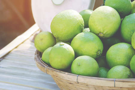 Organic Fresh Limes in the Basketの写真素材