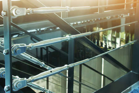 Closeup of Metal Hardware Parts of Stair Cable Railing Systemの写真素材