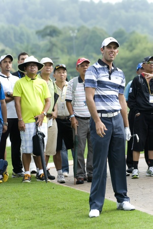 KUALA LUMPUR, MALAYSIA - APRIL 12: Charl Schwartzel of South Africa watching his ball after hits shot in the 13th holes during 1st round of Maybank Malaysian Open 2012 at Kuala Lumpur Golf & Country Club on Thursday, April 12, 2012のeditorial素材