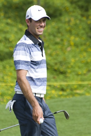 KUALA LUMPUR, MALAYSIA - APRIL 12: Charl Schwartzel of South Africa smiling after make his putt in the 16th green during 1st round of Maybank Malaysian Open 2012 at Kuala Lumpur Golf & Country Club on Thursday, April 12, 2012のeditorial素材