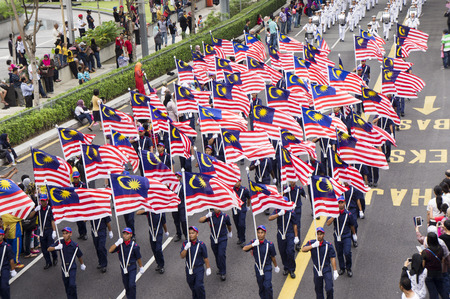 KUALA LUMPUR, MALAYSIA - AUGUST 31: Parade carrying Malaysia national flag during celebration of 57th Independence Day in Merdeka square, Kuala Lumpur, Malaysia on August 31, 2014のeditorial素材