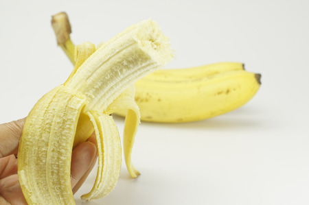 Close up of Peeled Banana isolated on white backgroundの写真素材