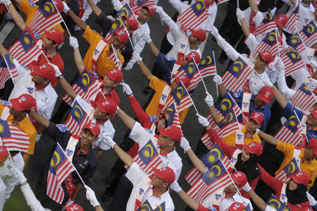 KUALA LUMPUR, MALAYSIA - AUGUST 31: Unidentified youth group waving Malaysia national flag during celebration of Malaysia Independence day 58th in Merdeka square, Kuala Lumpur, Malaysia on August 31, 2015のeditorial素材