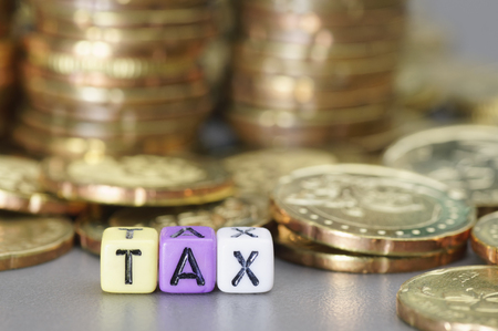 Tax word written on colorful dicesの写真素材