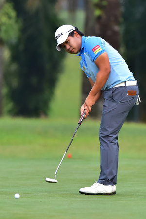 Kuala Lumpur - March 21: Poom Saksansin of Thailand make a putt at 10th green, during Round 1 of Maybank Championship 2019, at Saujana  Golf & Country Club,  Kuala Lumpur, on March 21, 2019.のeditorial素材