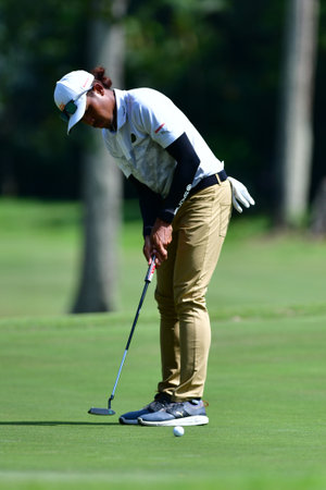PETALING JAYA, NOV 24 : Kemarol Baharin of Malaysia, teeing of at hole 13th, during Round 2 of PKNS Selangor Masters '22 at Kelab Golf Seri Selangor. Petaling Jaya, Malaysia on November 24, 2022.のeditorial素材