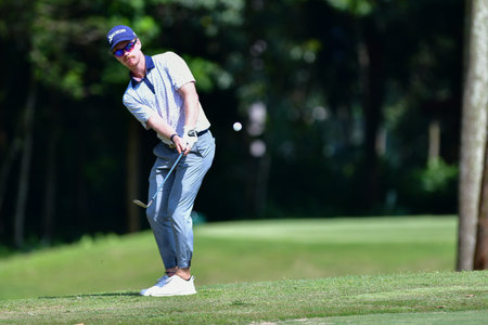 PETALING JAYA, NOV 24 : Kemarol Baharin of Malaysia, teeing of at hole 13th, during Round 2 of PKNS Selangor Masters '22 at Kelab Golf Seri Selangor. Petaling Jaya, Malaysia on November 24, 2022.のeditorial素材