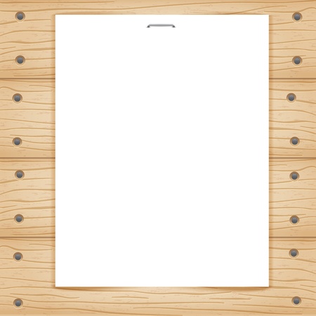 Blank paper sheet on wooden backgroundの写真素材