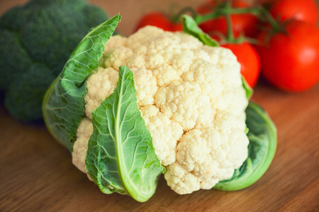 Cauliflower, Broccoli, tomato on the wooden boardの写真素材