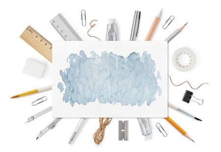 Sheet of paper A4 with watercolos spot and stationery supplies on white. Front cover top view. Mockup template to your design with space for text or image. Horizontal orientation.の写真素材