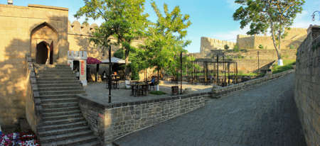 Derbent. Dagestan. Russia. 05/05/2018 year. The inner street of the Naryn Kala citadel. Monument of architecture of the 18th century. The inscription Excursion ancient Derbent. Souvenirs. Shawarma. Located on the mountain.のeditorial素材