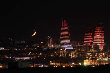 baku city. Azerbaijan. 02.10.2020 year. Beautiful moonset over the city.のeditorial素材