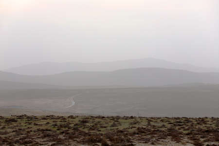 Beautiful silhouettes of mountains in the fog. Gobustan. Azerbaijan.の写真素材