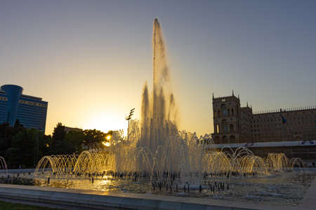Baku. Azerbaijan. 05.27.2020 Beautiful fountain at sunset on the boulevard.