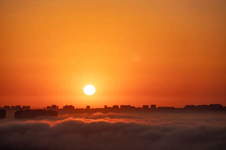 Fog spreading over the city at sunrise. Baku. Azerbaijan.の写真素材