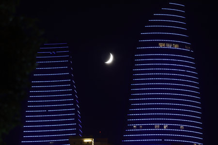 baku city. Azerbaijan. 23.07.2020 year. Big moon near the house with office rooms.のeditorial素材