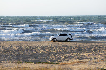 Bilgah. Azerbaijan. 05.05.2020 year. There is a white car on the seashore.のeditorial素材