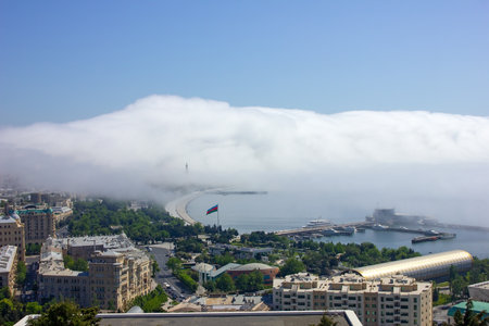 baku city. Azerbaijan. 05.16.2021 year. Fog creeping through the city.のeditorial素材