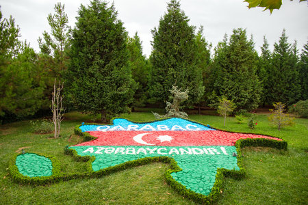 town. Ganja. Azerbaijan. 07.26.2021. The image of the territory of the Republic of Azerbaijan in the form of a flag in the Heydar Aliyev Park.のeditorial素材