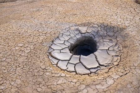 A beautiful, round, seething mud volcano in the mountains. Gobustan. Azerbaijan.の写真素材