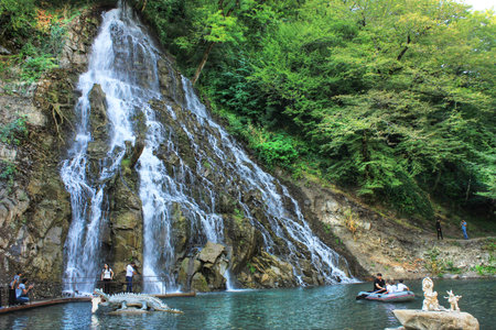 Oguz. Azerbaijan. 03.15.2017 Beautiful waterfall with a lake in the mountains.のeditorial素材
