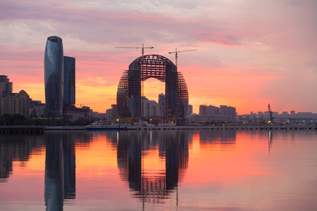 Baku. Azerbaijan. 07.30.2021. Beautiful red sunrise over the city.のeditorial素材