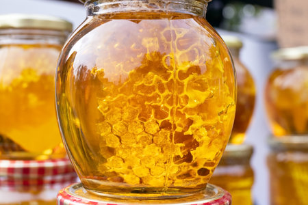 Glass jars filled with different types of honey. Gabala. Azerbaijan.