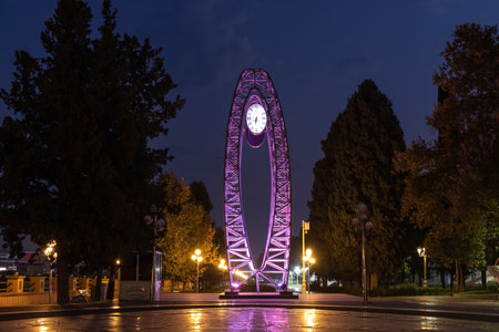 Ganja city. Azerbaijan. 18/10/2021. Beautiful clock in the evening park.のeditorial素材